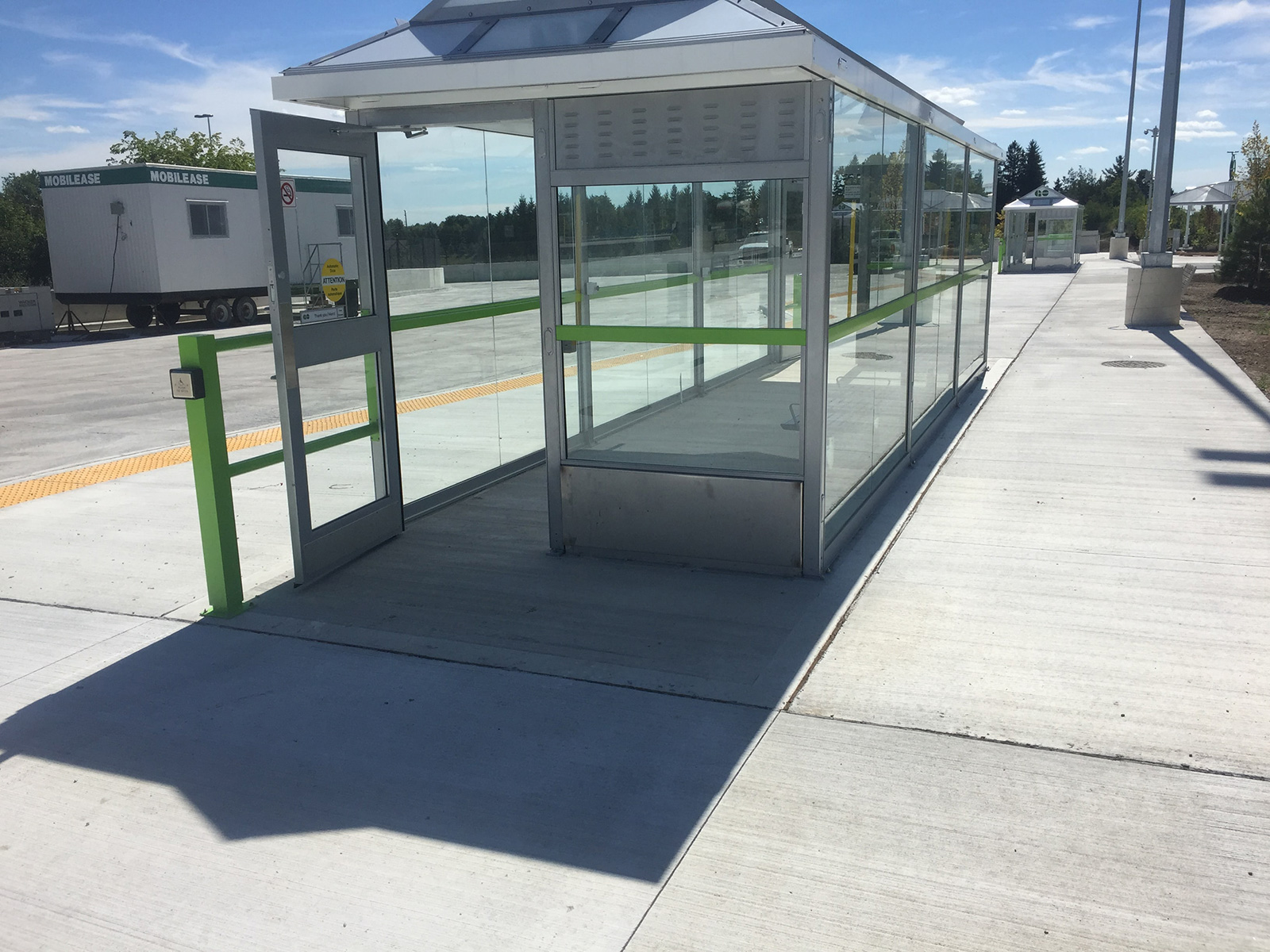 Finished concrete platform and glass transit shelter at Gormley GO Station